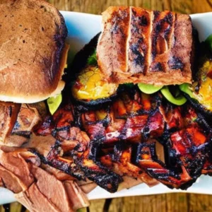Artistic representation for "explore top bbq destinations in pnw: texas monthly'